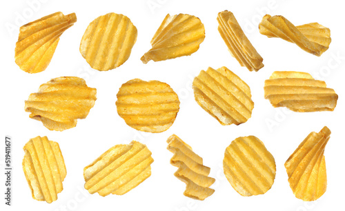 Set of ridged crispy potato chips on white background