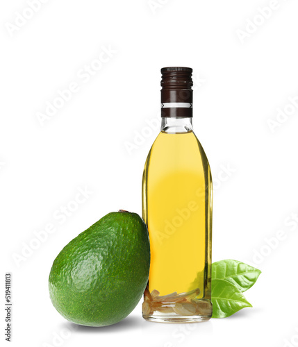 Cooking oil and ripe avocado on white background