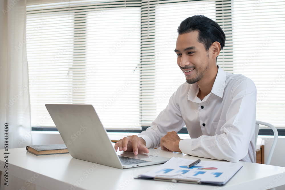 Asian accounting interns are using laptop to work on financial documents. Asian accounting interns are using laptop to work on financial documents.
