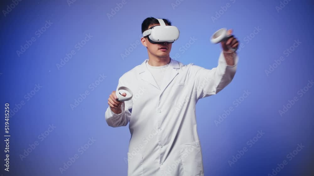 Korean man doctor using virtual reality glasses, playing video games, Asian guy nurse wearing new generation gaming headset for education, future technology concept. Korean man doctor using virtual reality glasses, playing video games, Asian guy nurse wearing new generation gaming headset for education, future technology concept.