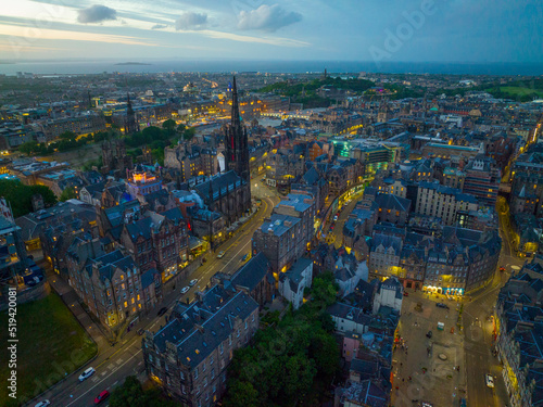 Old Town and Tolbooth Church on Royal Mile aerial view at sunset in Edinburgh, Scotland, UK. Old town Edinburgh is a UNESCO World Heritage Site since 1995. 