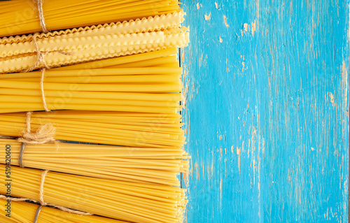 composition of raw Different shapes	 Italian Spaghetti pasta 
 photo