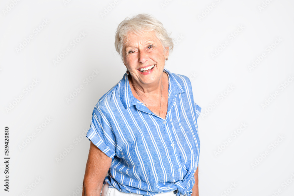 smiling retired senior woman looking at camera isolated on white background smiling retired senior woman looking at camera isolated on white background