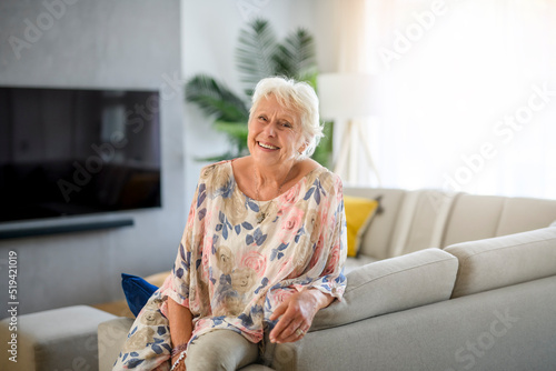Active beautiful senior woman in the living room.