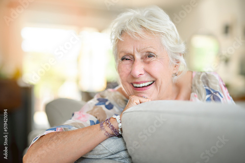 Active beautiful senior woman in the living room.