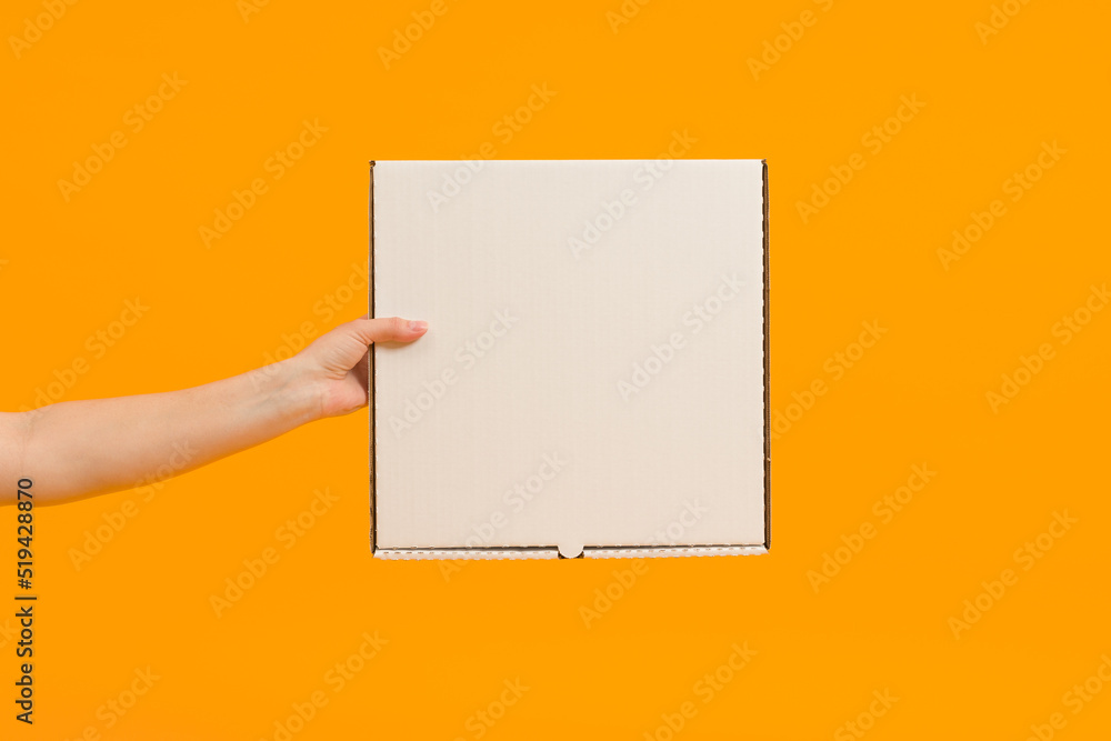 pizza box in hand on color background pizza box in hand on color background