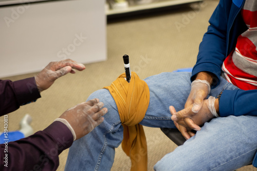 First aid training to treat a stab wound by fixing the object.