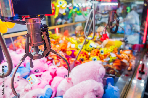 Fairground attraction catching stuffed toys 
