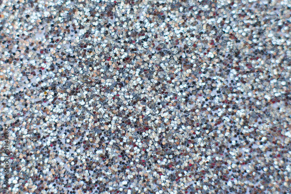 glittering background of silver sequins closeup. Sparkle festive texture glittering background of silver sequins closeup. Sparkle festive texture