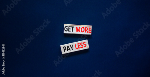 Get more pay less symbol. Concept words Get more pay less on wooden blocks on a beautiful black table black background. Business Get more pay less concept. Copy space.