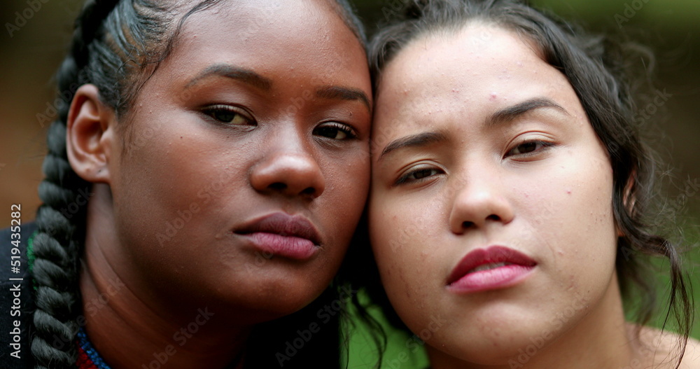 Beautiful ethnically diverse women posing to camera Beautiful ethnically diverse women posing to camera