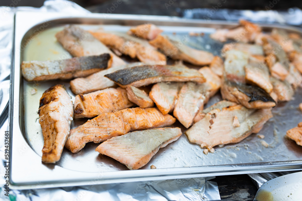 fresh fried pieces of red fish on a tray fresh fried pieces of red fish on a tray
