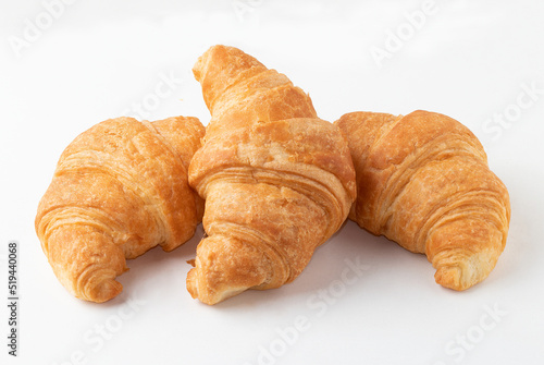 Triple salty croissant isolated on white background. photo