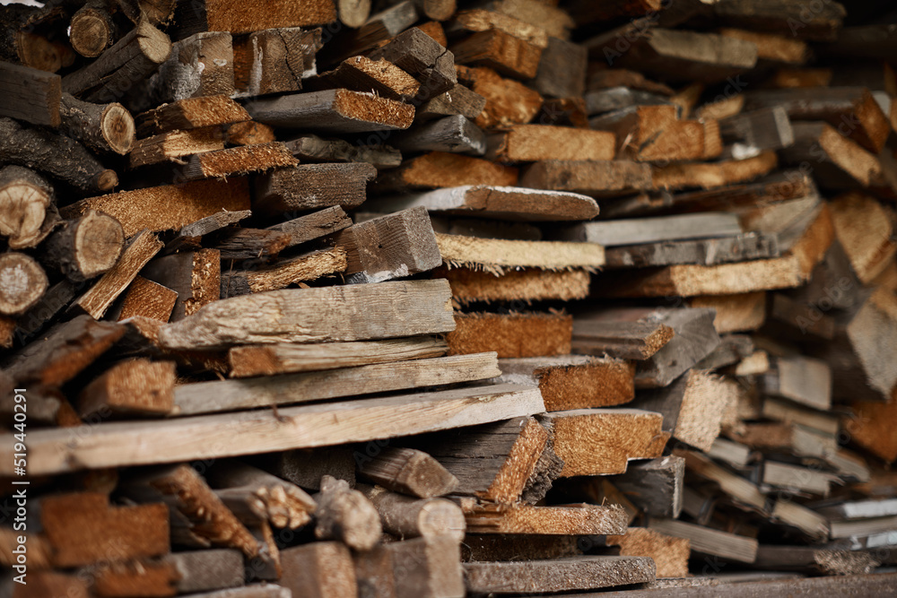Chopped dry firewood outside, in a barn. Chopped dry firewood outside, in a barn.