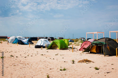 Tent camping on sand beach. Camping site. Recreational camping ground. Campground natural landscape