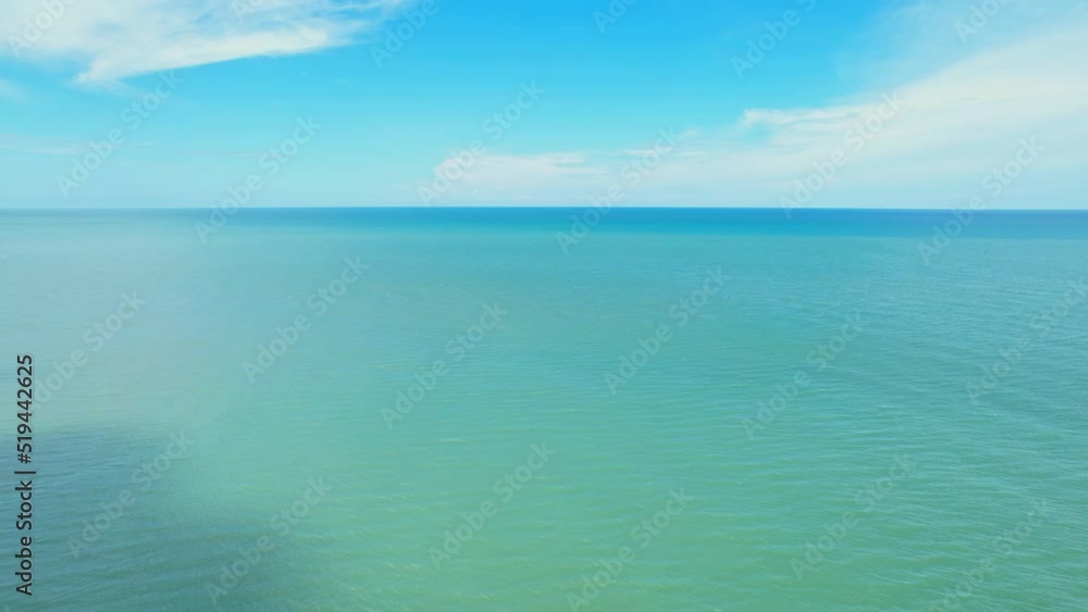 4K drone aerial view of beautiful ocean waves, fly over the sea, small waves in the sea. sea in the tropics. Background footage for summer. cinematic drone shot. Phetchaburi, Thailand
4K drone aerial view of beautiful ocean waves, fly over the sea, small waves in the sea. sea in the tropics. Background footage for summer. cinematic drone shot. Phetchaburi, Thailand