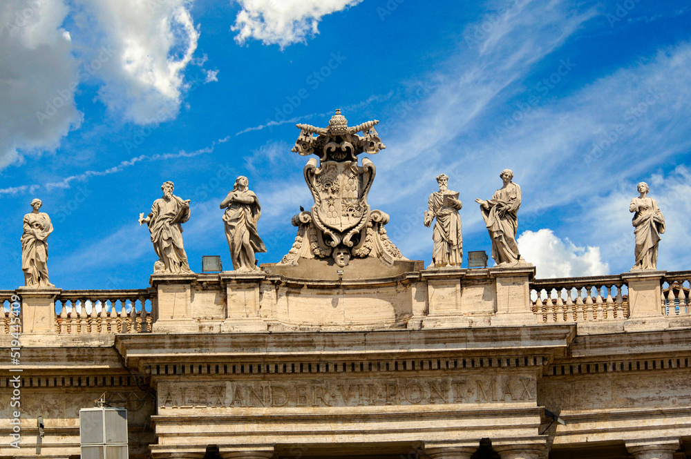 St. Peter`s Basilica Cathedral`s roof line with statues of apostles.