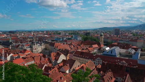 Aerial panorama view of Graz city old town from Castle Hill (Schlossberg) with historic buildings on a sunny summer day,  with blue sky cloud, Graz, Styria, Austria