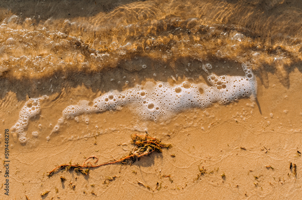 Background, texture of sand and waves on the sea, ocean view from above. Background, texture of sand and waves on the sea, ocean view from above.