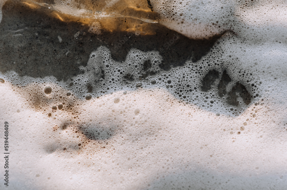 Background, texture from the beach of white foam from the sea, ocean on the sand. Photography of nature. Background, texture from the beach of white foam from the sea, ocean on the sand. Photography of nature.