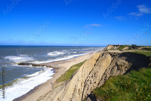 cliff of the North Sea coast near the bovbjerg fyr lighthouse and the beach and groyne, denmark, lemvig, ferring, vacation, jutland	