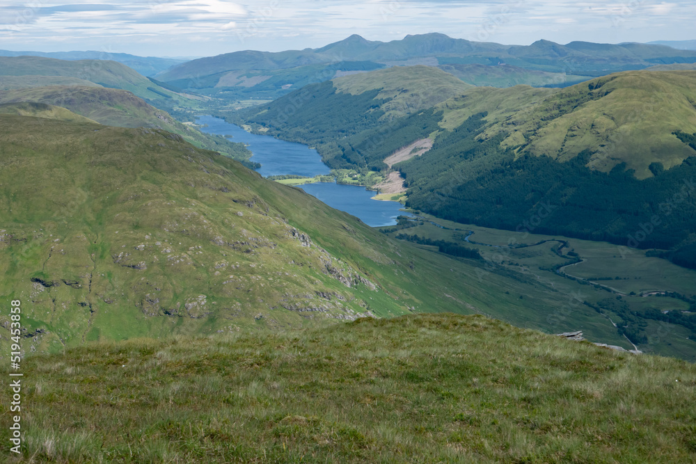 Scenic view of lake loch voil from a hill called beinn tulaichean, beautiful green hilly Scottish landscape Scenic view of lake loch voil from a hill called beinn tulaichean, beautiful green hilly Scottish landscape