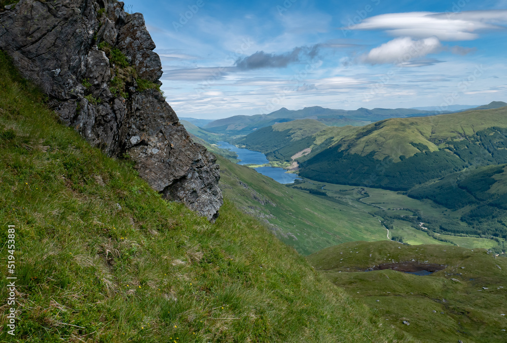 Scenic view of lake loch voil from a hill called beinn tulaichean, beautiful green hilly Scottish landscape