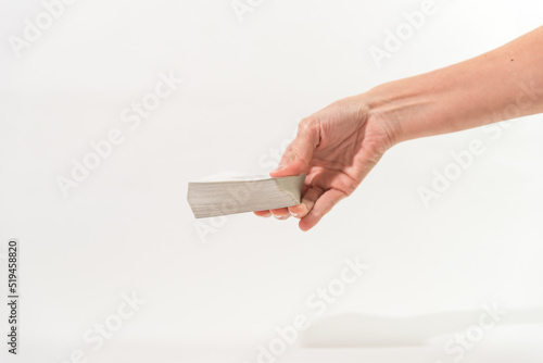 hand holding cards upside down