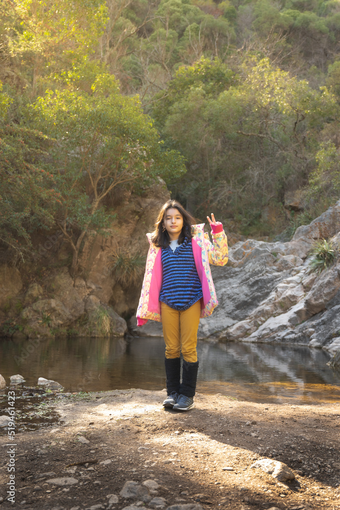 Naklejka premium teenage girls discovering forest and stream in autumn