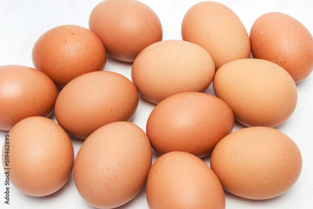 Close-Up of Fresh Raw Chicken Eggs on a White Background Close-Up of Fresh Raw Chicken Eggs on a White Background