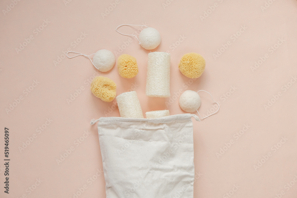 cognac sponges and loofah washcloths and a beige cotton bag on a beige light background.Eco friendly bio natural cosmetics.reasonable consumption cognac sponges and loofah washcloths and a beige cotton bag on a beige light background.Eco friendly bio natural cosmetics.reasonable consumption
