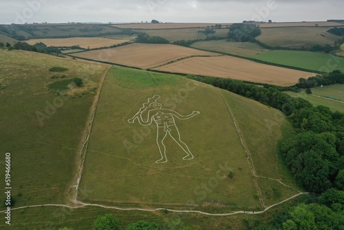 Aerial photo of The Cerne Abbas Giant is a hill figure near Cerne Abbas in Dorset, England. 55 metres high, it depicts a standing nude male with a prominent erection and a large club in its right hand photo