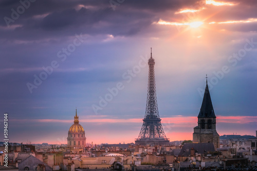 Eiffel tower and parisian roofs at sunrise Paris, France