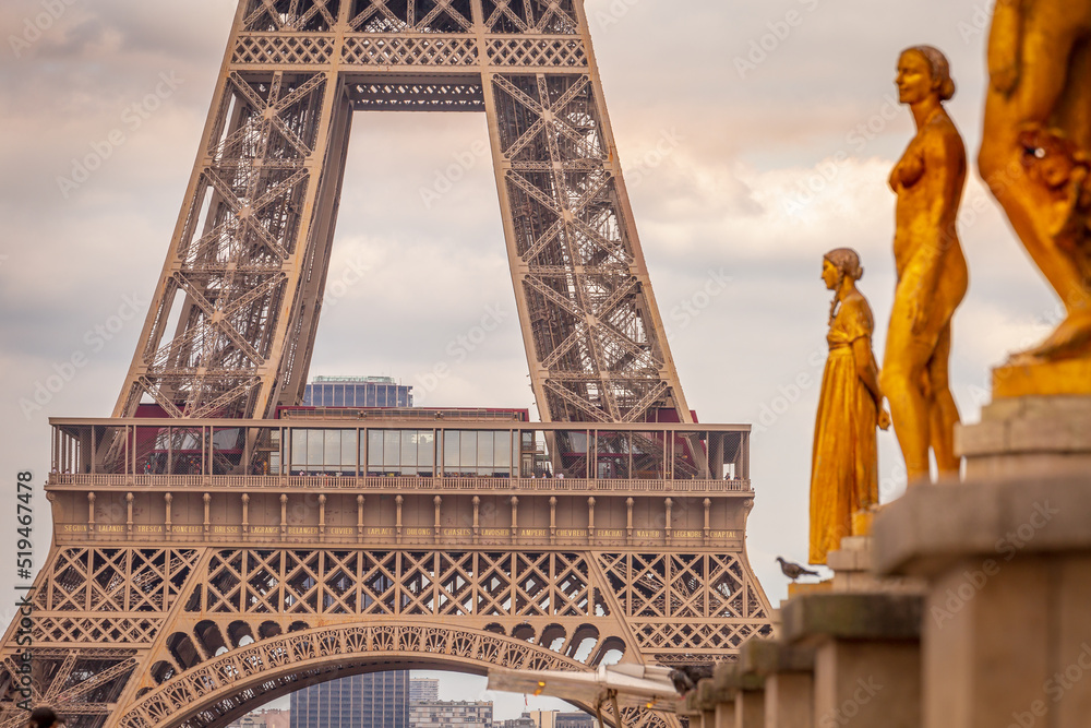 Eiffel tower from Trocadero with golden statues, Paris, France - obrazy, fototapety, plakaty 