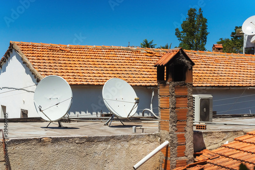 Fotografija satellite dishes on the roof of a house in cyprus