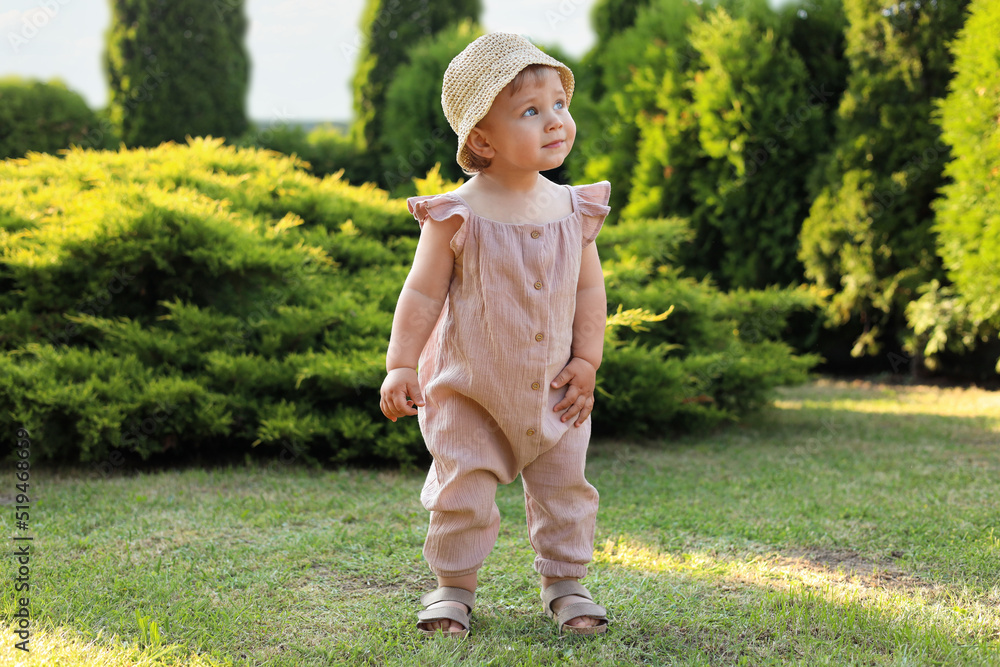 Cute little girl wearing stylish clothes outdoors on sunny day Cute little girl wearing stylish clothes outdoors on sunny day