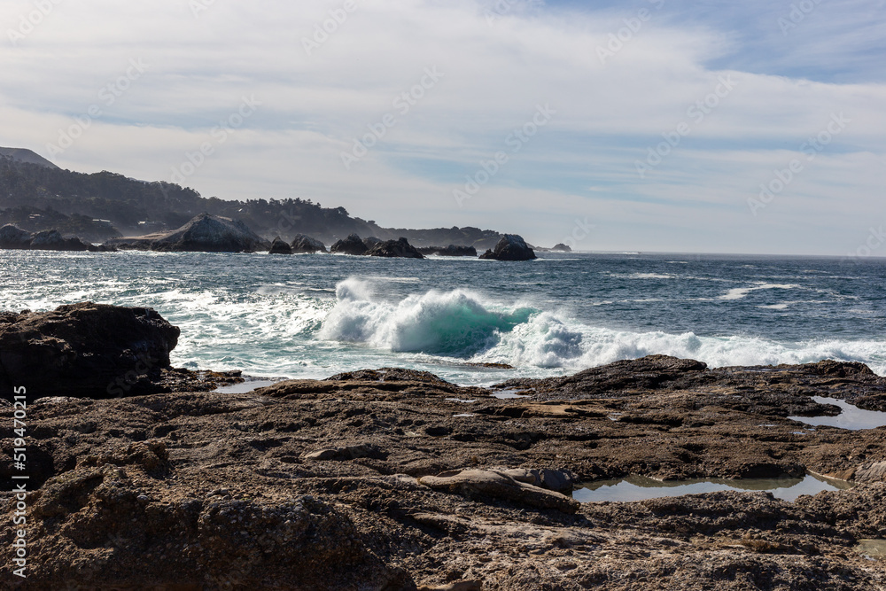 A view on Pacific ocean with rocks and waves