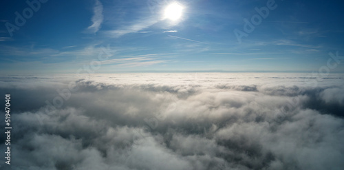 Fototapeta Naklejka Na Ścianę i Meble -  Aerial view from high altitude of earth covered with puffy rainy clouds forming before rainstorm