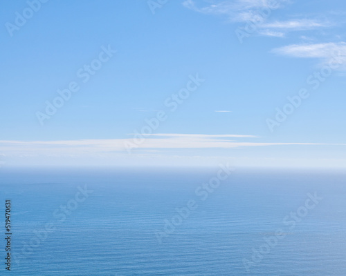 Peaceful, calm and soft ocean view with empty sea, blue sky copy space and background in summer. Serene aerial landscape and copyspace of an open aqua surface seascape with light cloud on the horizon