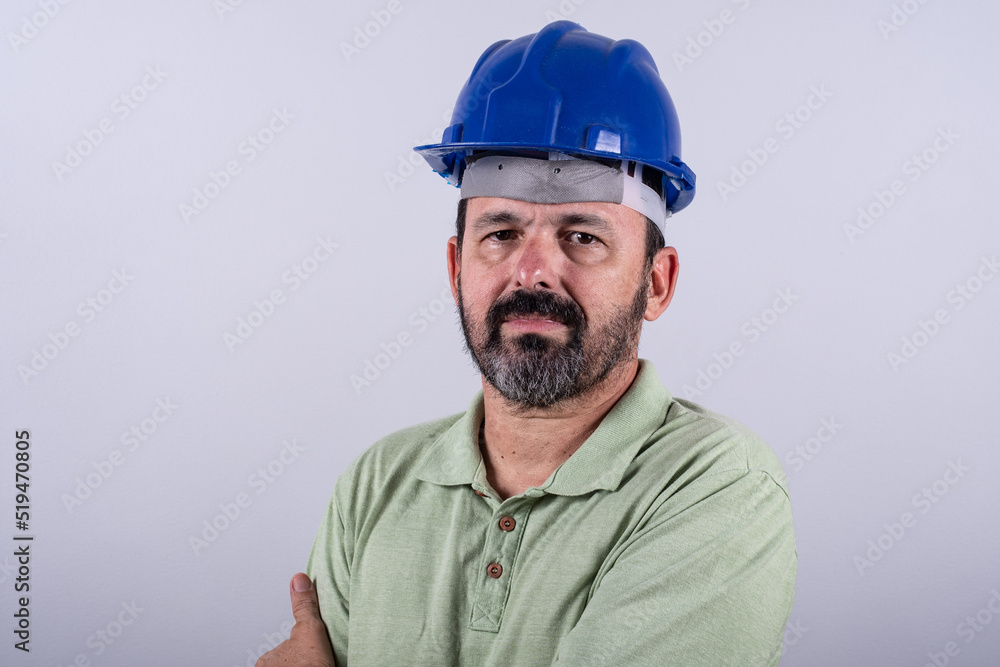 Portrait of happy mature architect in helmet standing male industrial inspector, 60s wearing shirt posing in studio. Portrait of happy mature architect in helmet standing male industrial inspector, 60s wearing shirt posing in studio.