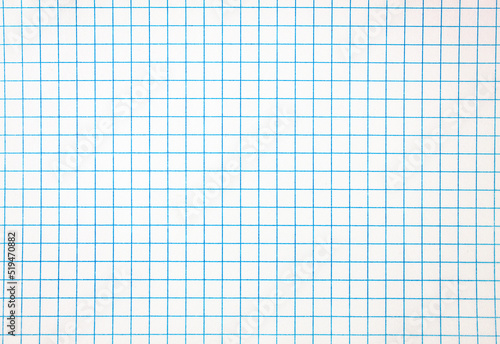 Notepad texture. Sheet of notebook in a blue cage. Authentic, original notebook background, texture.