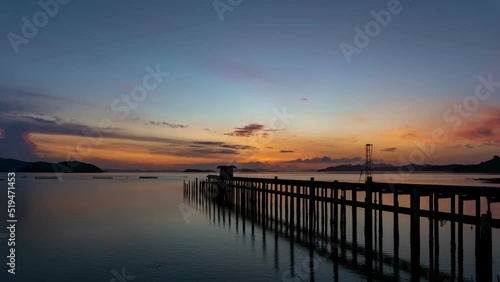 Wallpaper Mural Small jetty in to the sea in sunrise or sunset sky over sea.Golden light beautiful nature landscape 4K-timelapse Torontodigital.ca