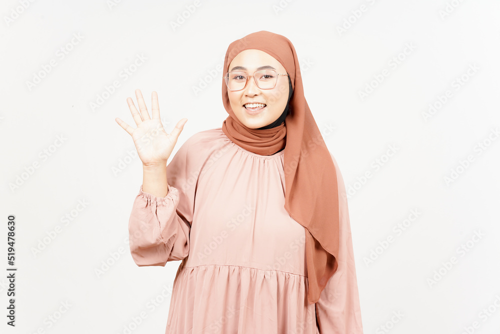 Hi greeting gesture of Beautiful Asian Woman Wearing Hijab Isolated On White Background Hi greeting gesture of Beautiful Asian Woman Wearing Hijab Isolated On White Background