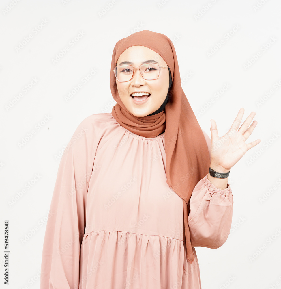 Hi greeting gesture of Beautiful Asian Woman Wearing Hijab Isolated On White Background Hi greeting gesture of Beautiful Asian Woman Wearing Hijab Isolated On White Background