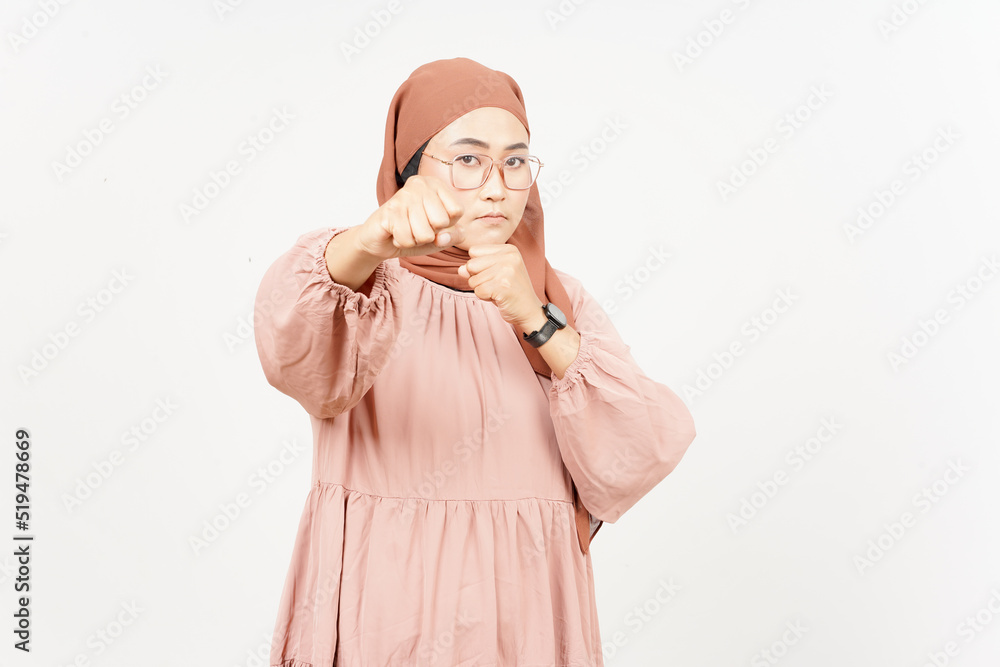 Punching fist to fight of Beautiful Asian Woman Wearing Hijab Isolated On White Background
