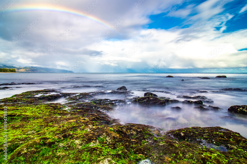 rainbow ove beach at Laniakea on north shore of Oahu