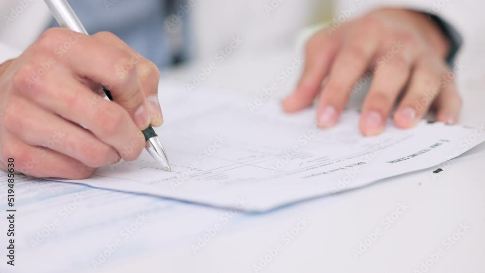 Closeup of the hands of a healthcare professional drafting a medical letter or form. A GP filing a document in an office. Doctor writing a prescription on paper on his desk at the hospital.