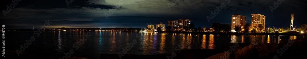 Downtown Barrie at night Centennial beach  night time panorama with lights reflecting on lake 