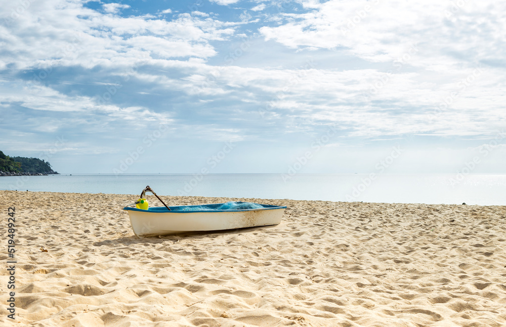 Fototapeta premium Boat on sandy beach, tropical island in south of Thailand, fishing boat on the beach