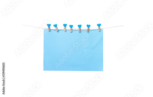 фотографія Sven wood clothes pegs with blank blue paper hanging on white string isolated on
